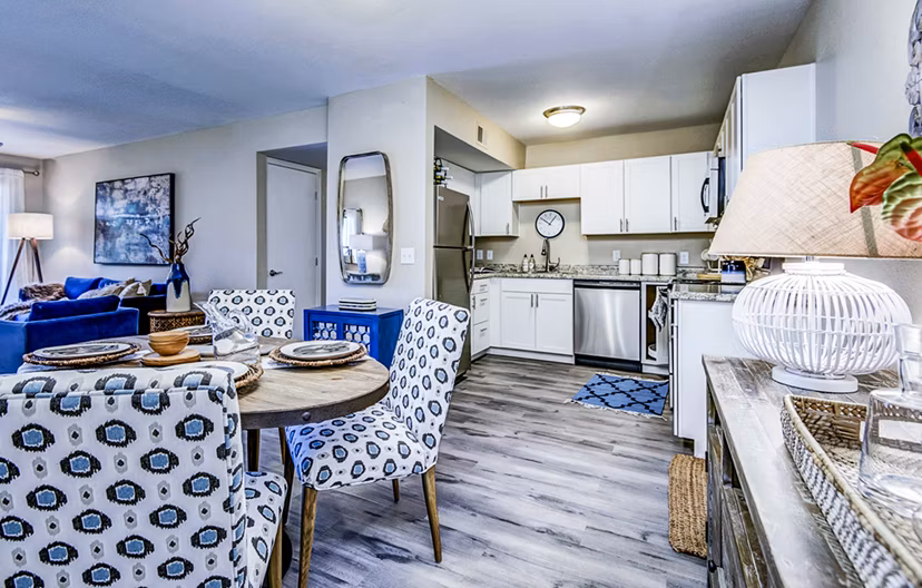 Dining room with modern decor and natural lighting at HUE97 Apartments