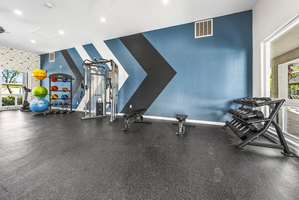 Fitness center with modern equipment at HUE97 Apartments