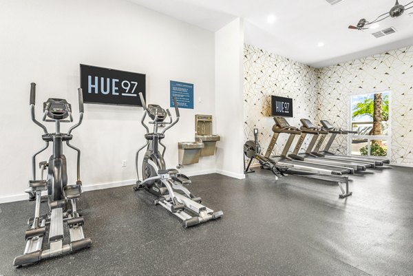 State-of-the-art fitness center with modern equipment at HUE97 Apartments, a luxury community