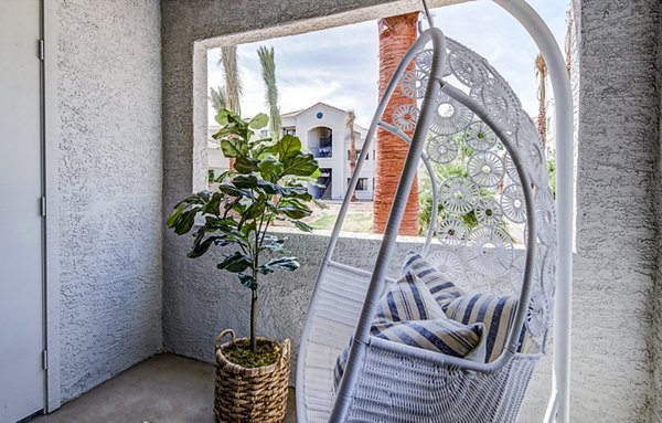 Chic balcony with stylish lounge furniture at HUE97 Apartments