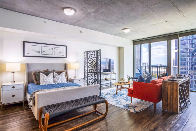 Modern bedroom with cozy decor at SoDo on Main North Apartments, highlighting luxury living