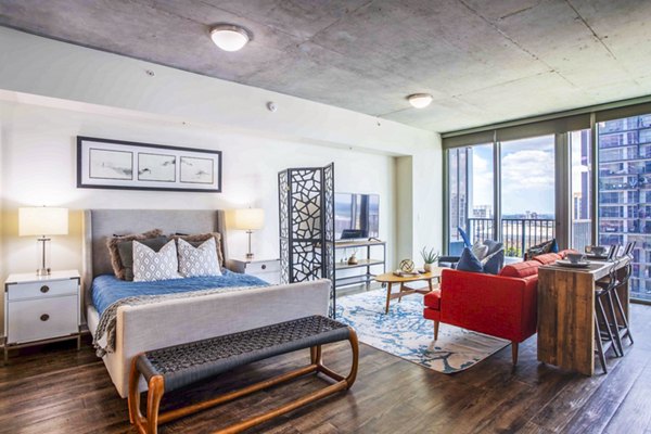 Modern bedroom with cozy decor at SoDo on Main North Apartments, highlighting luxury living