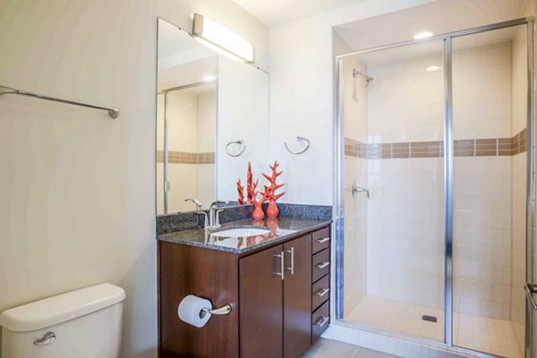 SoDo on Main North: Modern bathroom with sleek fixtures and ample lighting