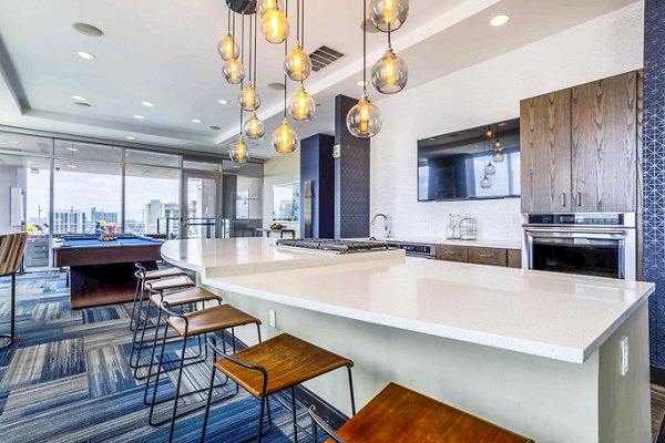 Clubhouse with modern design at SoDo on Main North Apartments featuring luxury amenities