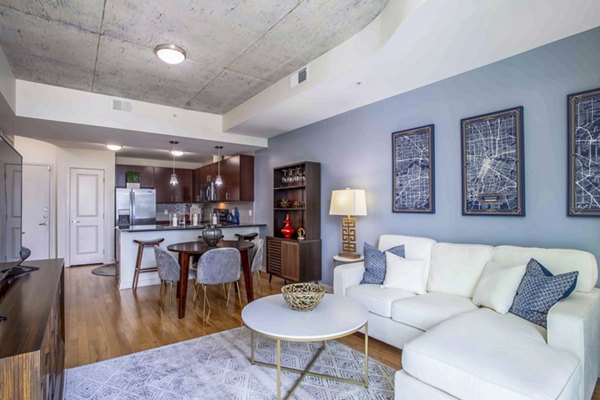 Spacious living room featuring modern decor and natural light at SoDo on Main North Apartments