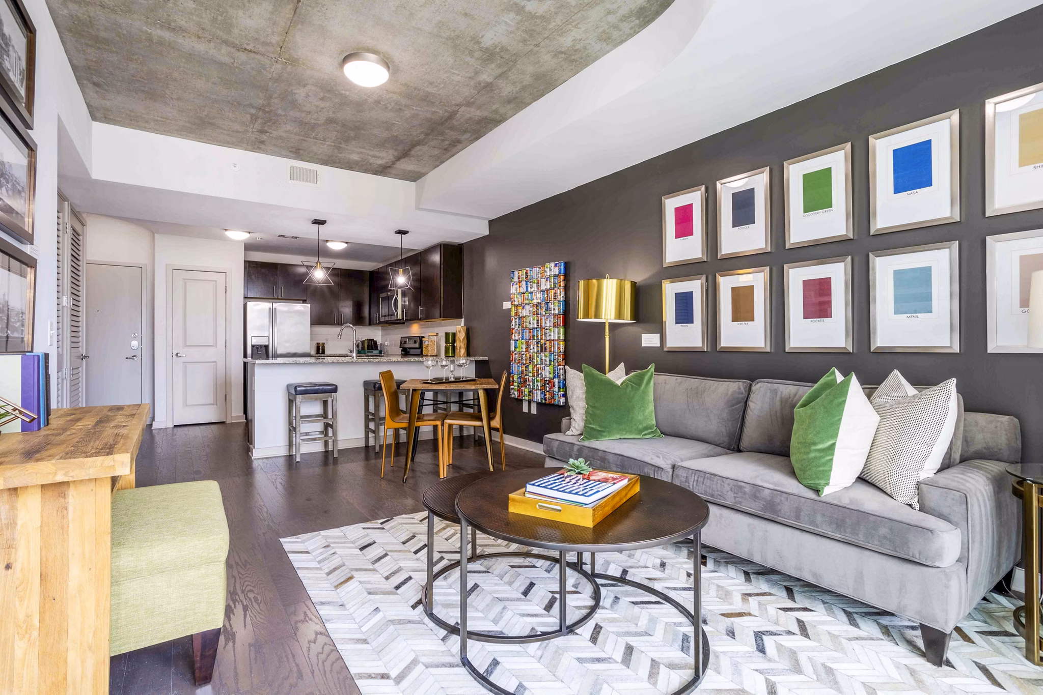 Living room featuring a cozy sofa and modern decor at SoDo on Main North Apartments