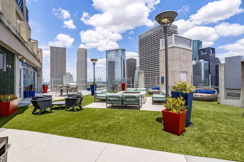 Cozy fire pit on the patio at SoDo on Main North Apartments featuring comfortable outdoor seating