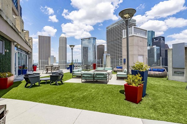 Cozy fire pit on the patio at SoDo on Main North Apartments featuring comfortable outdoor seating