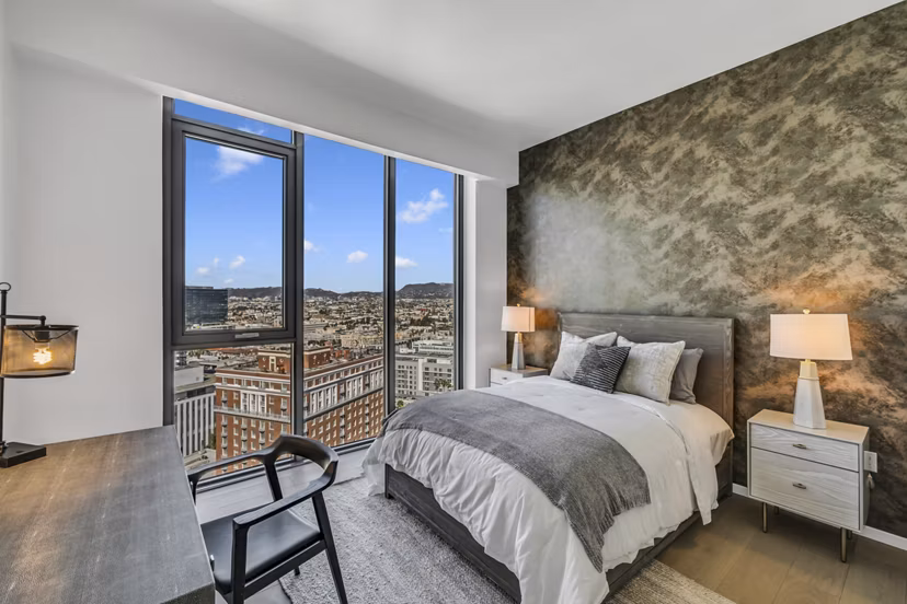 Spacious bedroom with modern furnishings at Kurve Apartments