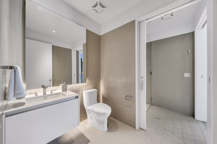 Bathroom featuring modern fixtures and sleek design in Kurve Apartments