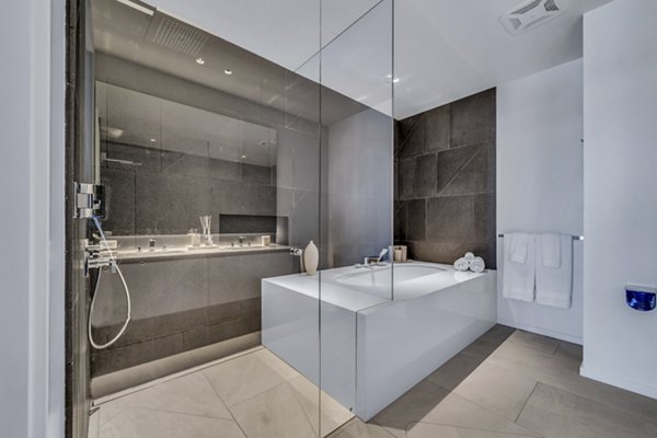 Luxurious bathroom with modern fixtures at Kurve Apartments, enhancing comfort and style in premier living spaces