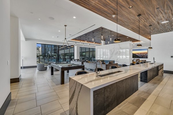 Elegant clubhouse with modern design at Kurve Apartments, perfect for social gatherings and leisure activities