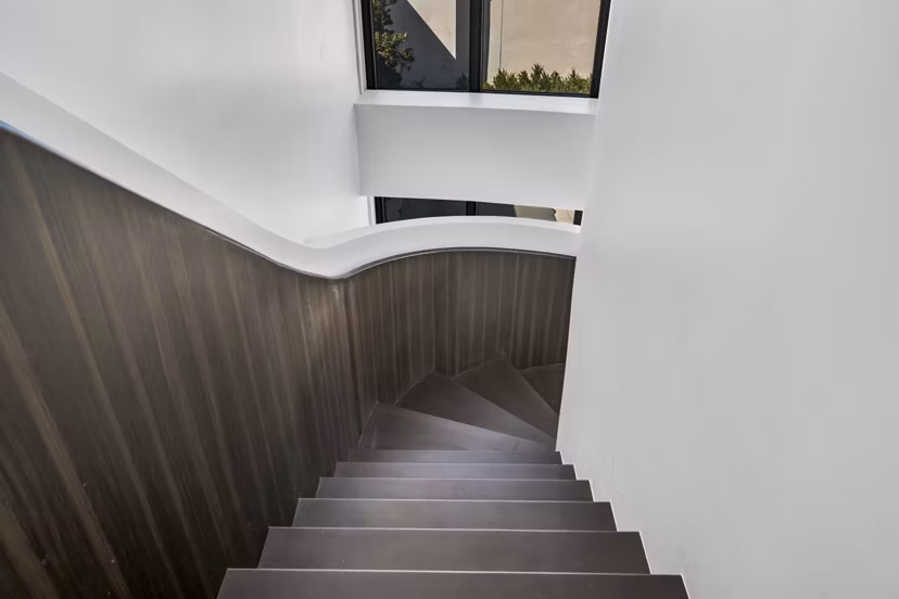 Kurve Apartments: Modern clubhouse with stylish seating and entertainment areas in a vibrant community setting