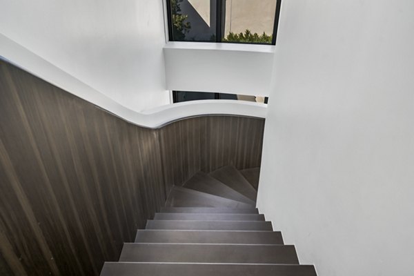 Kurve Apartments: Modern clubhouse with stylish seating and entertainment areas in a vibrant community setting