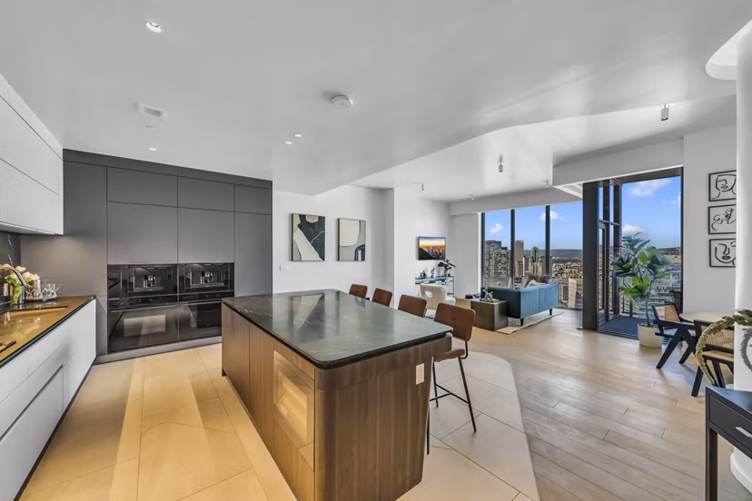 Modern kitchen with sleek countertops and stainless appliances in Kurve Apartments, offering luxury living spaces in Los Angeles