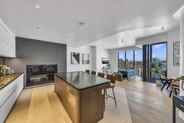 Modern kitchen with sleek countertops and stainless appliances in Kurve Apartments, offering luxury living spaces in Los Angeles