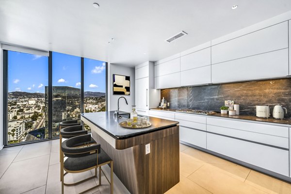 Sleek kitchen with modern appliances at Kurve Apartments, Los Angeles: Stylish design in Greystar luxury apartment community