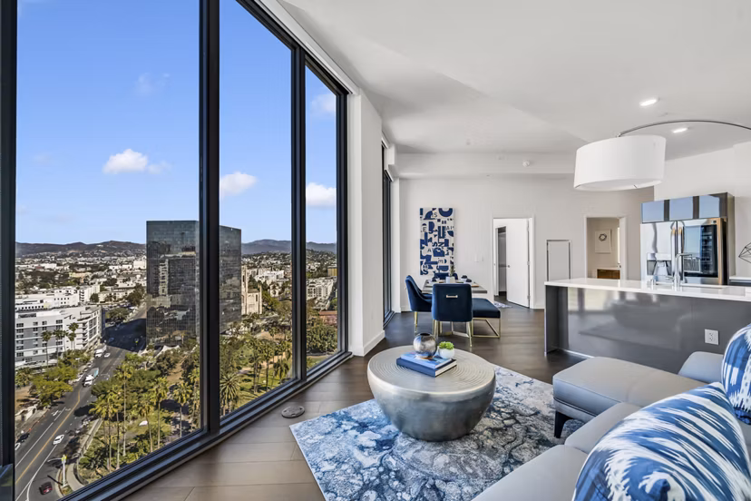 Spacious, modern living room with stylish decor at Kurve Apartments in a luxury property managed by Greystar