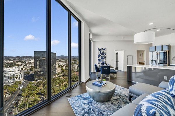 Spacious, modern living room with stylish decor at Kurve Apartments in a luxury property managed by Greystar