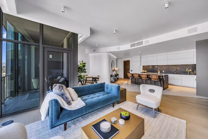 Elegant living room featuring modern decor and natural light at Kurve Apartments