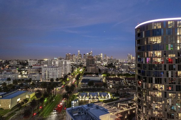 Downtown views at Kurve Apartments: Luxury living with spacious balconies in Los Angeles
