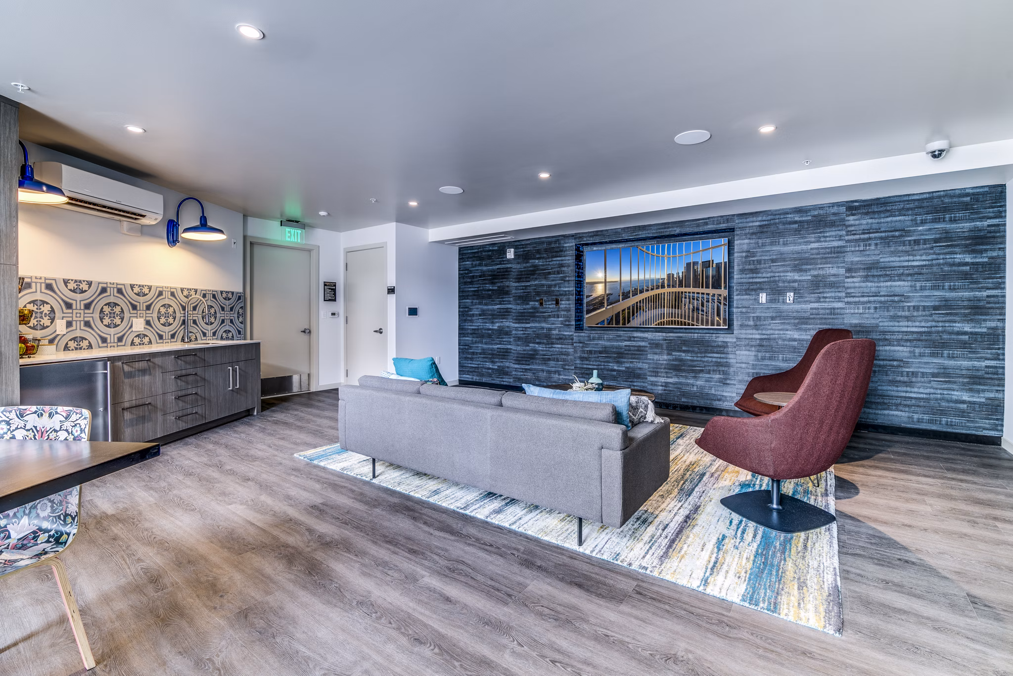 Clubhouse with modern design elements at Batik Apartments, offering comfortable lounge seating and social spaces