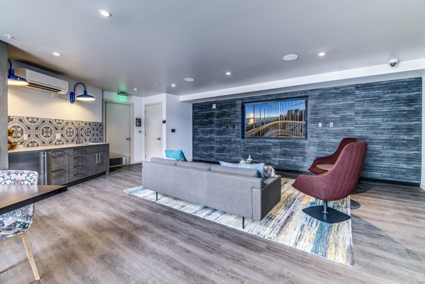 Clubhouse with modern design elements at Batik Apartments, offering comfortable lounge seating and social spaces