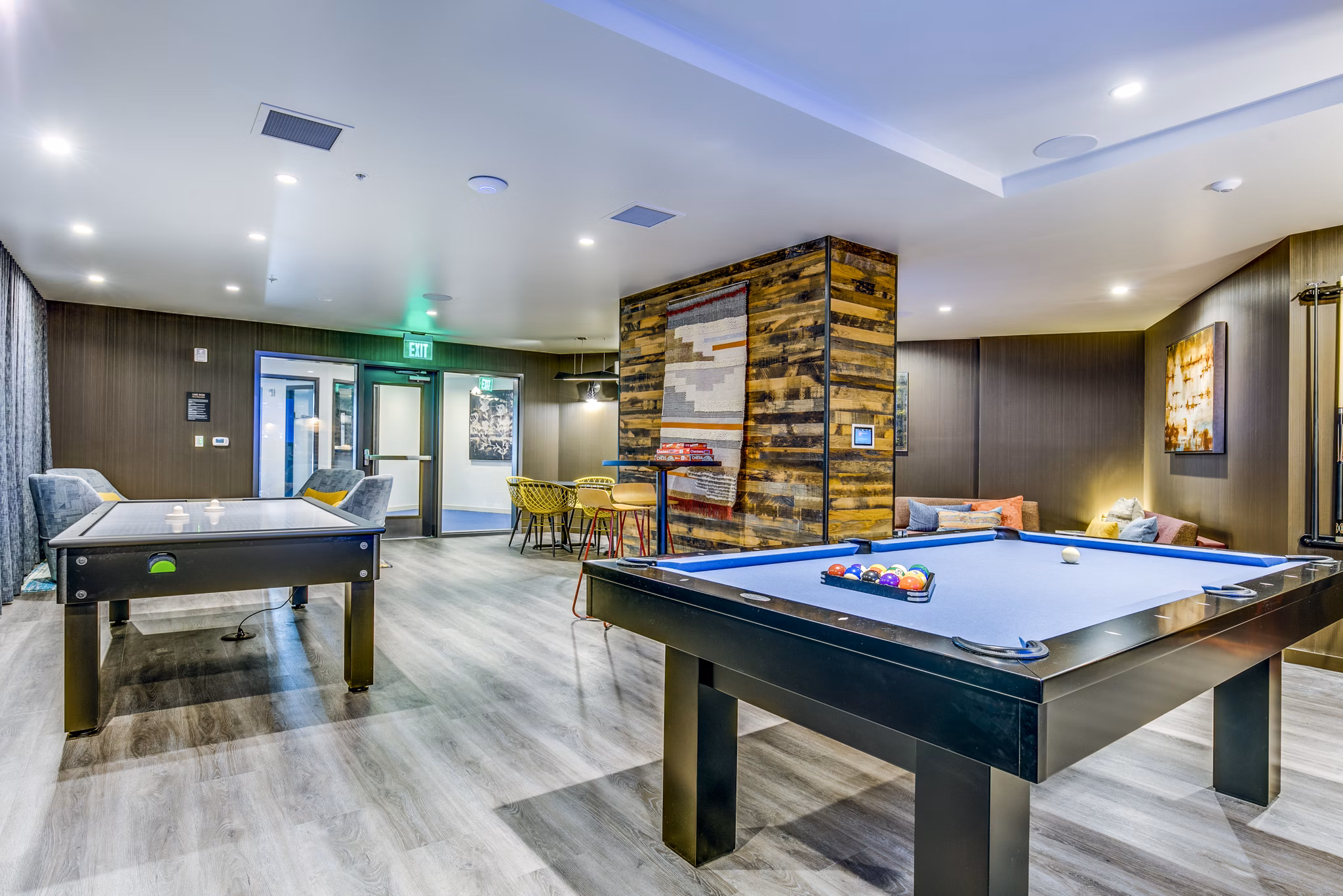 Game room featuring pool table and modern decor at Batik Apartments