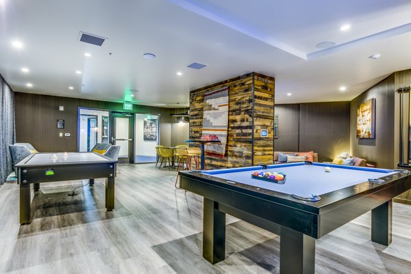 Game room featuring pool table and modern decor at Batik Apartments