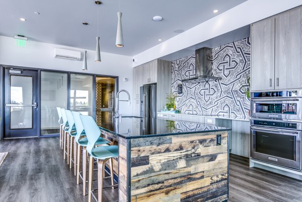 Batik Apartments: Modern clubhouse with a patio kitchen, ideal for social gatherings and relaxation spaces