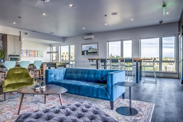 Clubhouse patio and game room with modern dÃ©cor at Batik Apartments, offering luxury amenities for residents