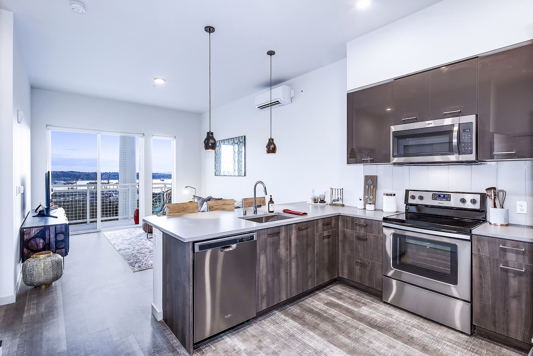 Modern kitchen with stainless steel appliances in Batik Apartments