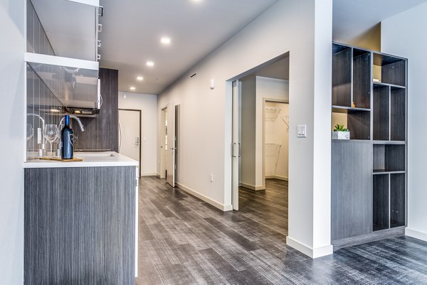 Hallway entrance with modern lighting and sleek design at Batik Apartments