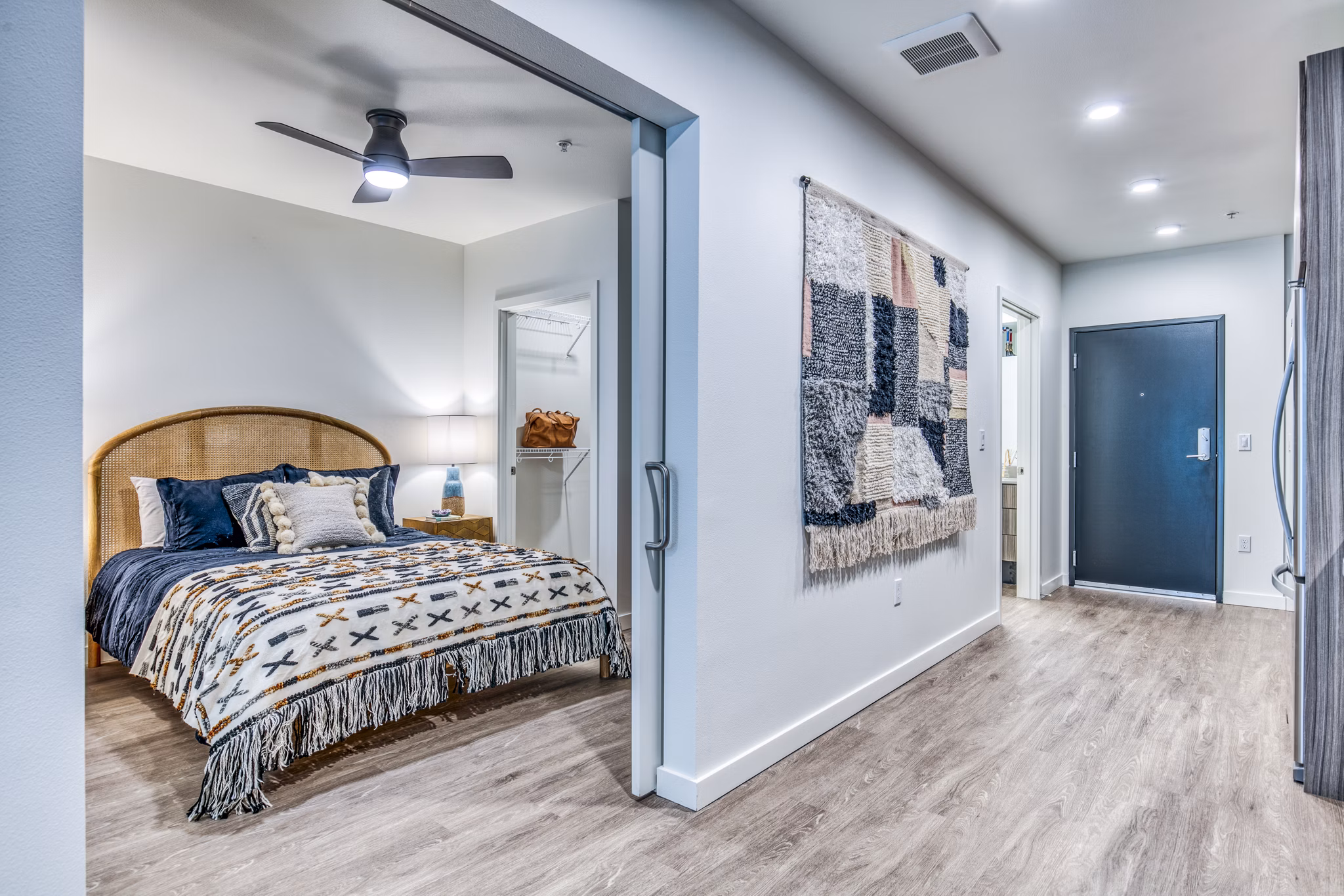 Cozy bedroom with modern decor in Cypress Apartments offering luxury living