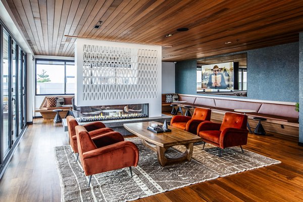 Clubhouse featuring modern decor and spacious seating areas at Cypress Apartments