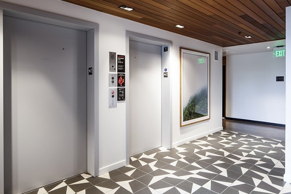 Hallway with an elevator at Cypress Apartments luxury building