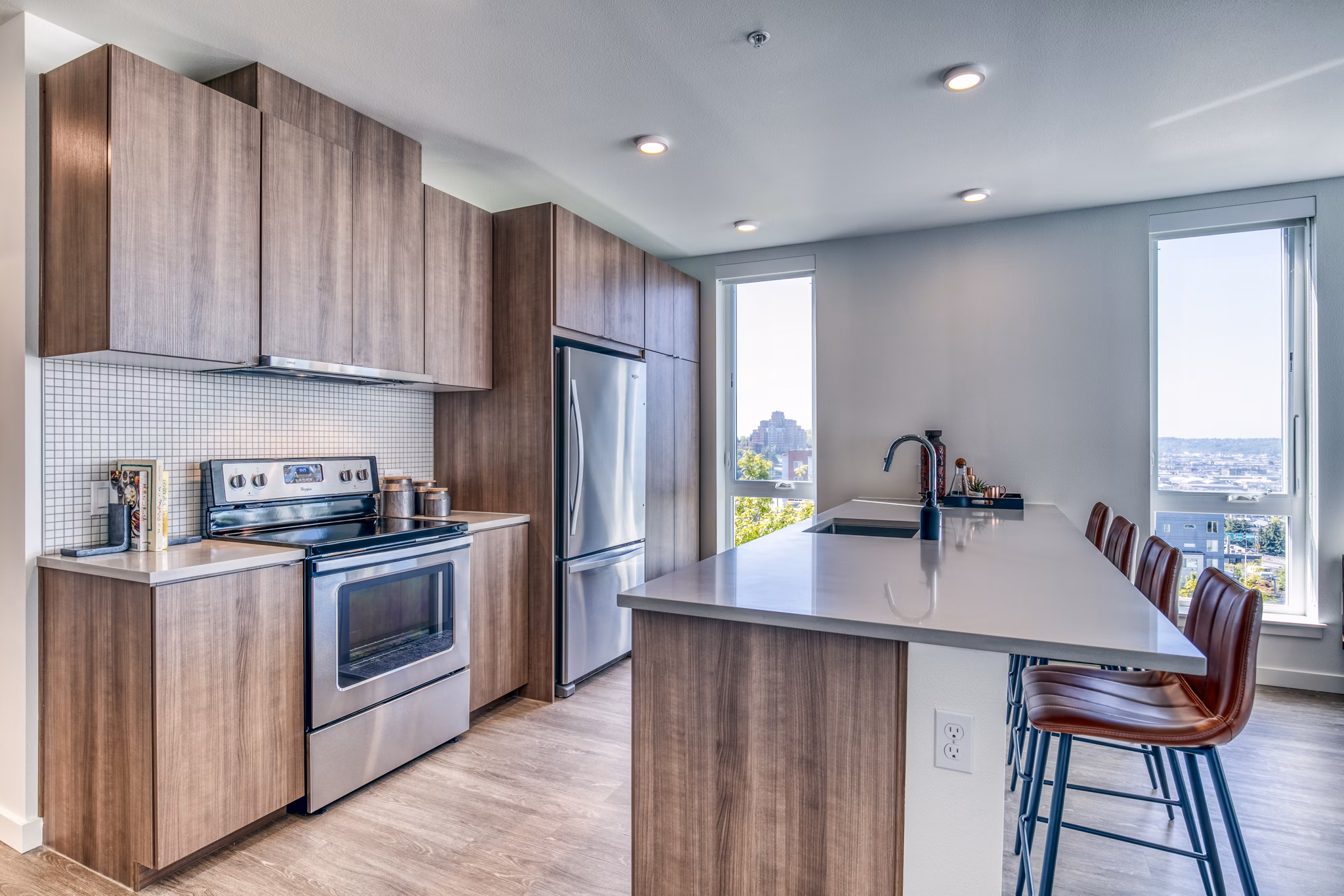 Modern kitchen with stainless steel appliances at Cypress Apartments luxury apartments