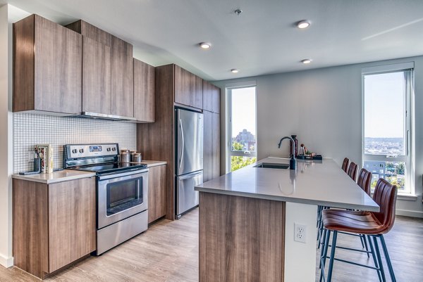 Modern kitchen with stainless steel appliances at Cypress Apartments luxury apartments