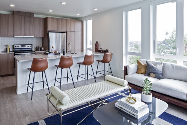 Dining room with modern decor and large windows at Cypress Apartments