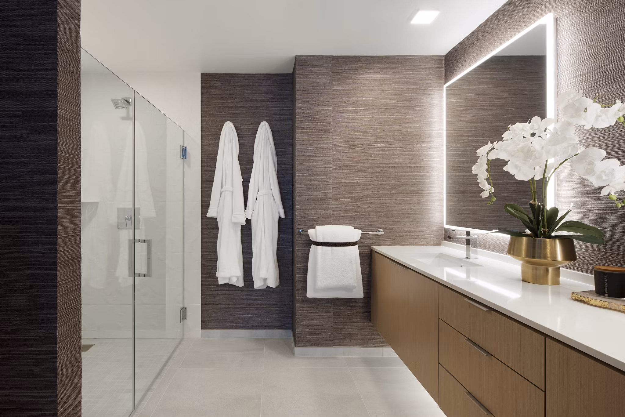 Luxurious bathroom with marble countertops at 525 Olive Apartments, showcasing elegance and modern design in San Diego