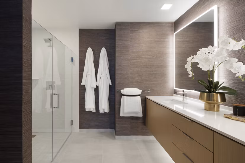 Luxurious bathroom with marble countertops at 525 Olive Apartments, showcasing elegance and modern design in San Diego