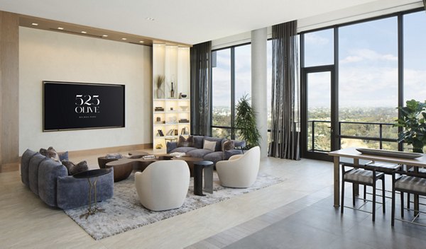 Clubhouse featuring modern furnishings and open layout at 525 Olive Apartments