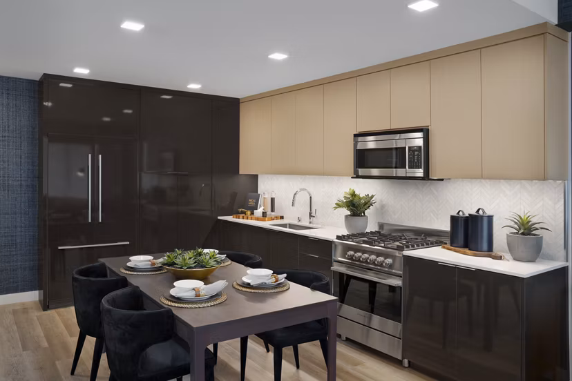 Elegant dining area with modern furnishings at 525 Olive Apartments in downtown, showcasing luxury urban living