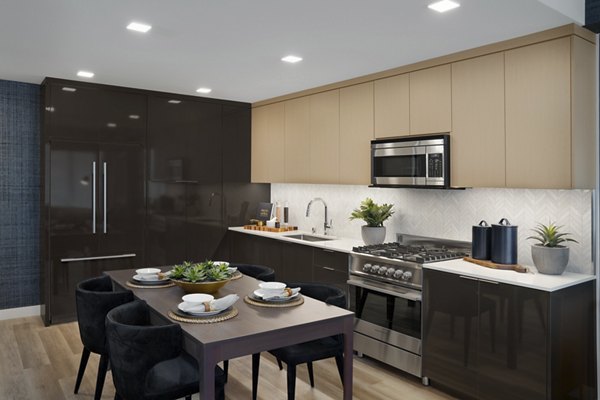 Elegant dining area with modern furnishings at 525 Olive Apartments in downtown, showcasing luxury urban living