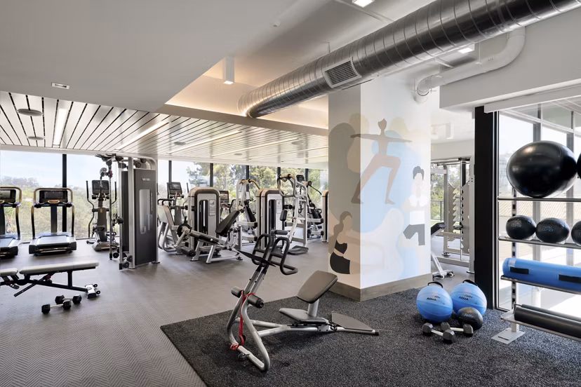 State-of-the-art fitness center with modern equipment at 525 Olive Apartments