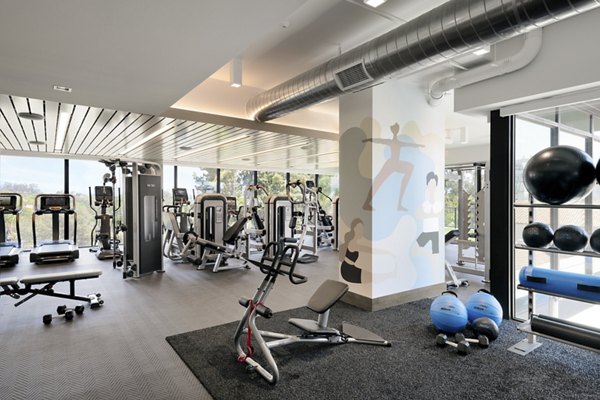 State-of-the-art fitness center with modern equipment at 525 Olive Apartments