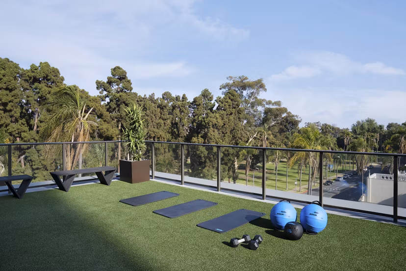 State-of-the-art fitness center with modern equipment at 525 Olive Apartments, luxury living in a prime location