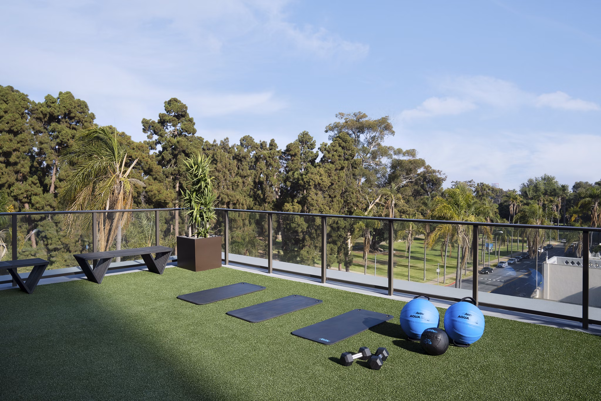 State-of-the-art fitness center with modern equipment at 525 Olive Apartments, luxury living in a prime location