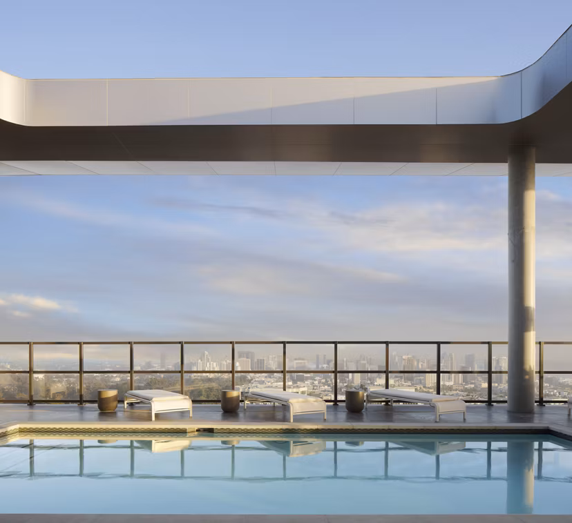 Pool with city skyline views at 525 Olive Apartments