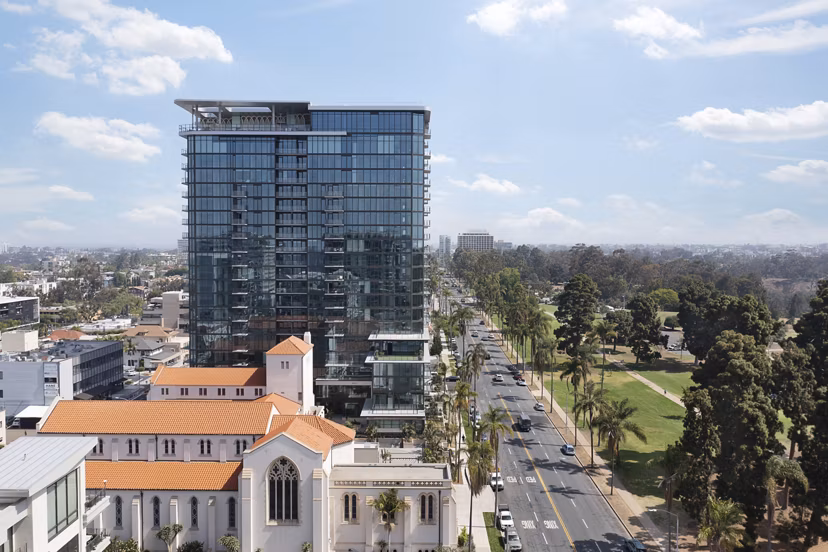 Cityscape view from 525 Olive Apartments' balcony in vibrant downtown with luxury modern features